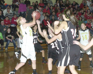 R-T Photo/Seth Herrold Trenton’s Ashten Whitaker pulls down a rebound during the Trenton Middle School girls’ 39-28 victory over Chillicothe in the girls A game Monday night in Trenton. Whitaker scored four points in the win.