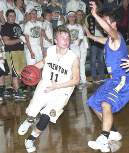 R-T Photo/Seth Herrold Chase Tolson drives the baseline during the Bulldogs 52-43 loss to East Buchanan Tuesday night. Tolson finished the game with 18 points.