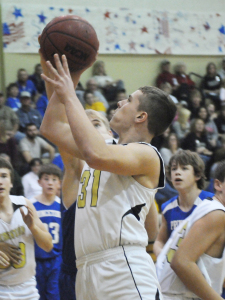 R-T Photo/Seth Herrold Jadan Whitney puts up two of his team-high 12 points during the TMS boys’ A game win over Princeton. Whitney had eight rebounds as well.