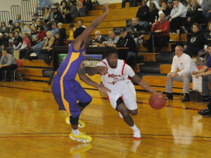 R-T Photo/Diane Lowrey Tyrell Thirkield blows past an Ellsworth defender during the Pirates’ 92-82 win Wednesday night in Trenton. Thirkield scored 10 points to go with six assists in the victory.