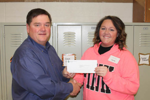 The GEC Community Foundation, Inc. awarded the Trenton R-9 School District with a grant in the amount of $517.67 to purchase CD Players and Listening Library CDs. S.M. Rissler Elementary School second grade teacher Katelin Gann, right, accepted the grant check from Foundation Trustee Dennis Gutshall of Trenton.   