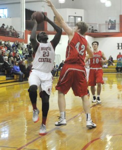R-T Photo/Diane Lowrey North Central’s Xavier Newson shoots over the outstretched arm of a North Arkansas defender duing the Pirates’ 111-108 victory on Saturday in the Ketcham Community Center. Newson had 16 points in the win.