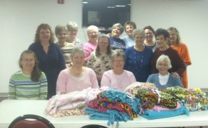 The Wright Memorial Hospital Auxiliary Group and the First Baptist Church Crafty Ladies combined efforts on Monday afternoon to hand-make fleece blankets for patients undergoing chemotherapy treatments at Wright Memorial Hospital. Nearly 30 blankets were made to care for patients that are in need of some extra comfort. A Bible verse was attached to each blanket to also comfort the patient. The WMH Auxiliary is an active volunteer organization within Wright Memorial Hospital. Greeting patients in the main lobby, outpatient specialty clinic registration, and rehab services and gift shop management are among the duties. Those interested in volunteering need to call 660-358-5706. The FBC Crafty Ladies is a local group that meets at the First Baptist Church every Monday afternoon from 1 to 3 p.m. This group works on all kinds of crafts and often times do projects and donate items to community service organizations and mission efforts. Those interested in joining the club can call Marilyn Bain at 359-2456. 