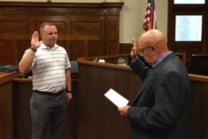 Photo Courtesy of Grundy County Sheriff Rodney Herring The Grundy County Sheriff’s Department has a new deputy, but it is someone who is very familiar to the local law enforcement community. Derek Miller, left, was sworn in as the county’s newest deputry by Circuit Court Judge Jack Peace on Tuesday. Miller had been serving as an officer with the Trenton Police Department and begins his new duties today.