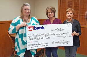 Submitted Photo  The US Bancorp Foundation donated $500 to the United Way of Grundy County.  Pictured are, from left, Megan L. Terhune of US Bank and Connie Reed and Marleen Johnson of the United Way.  